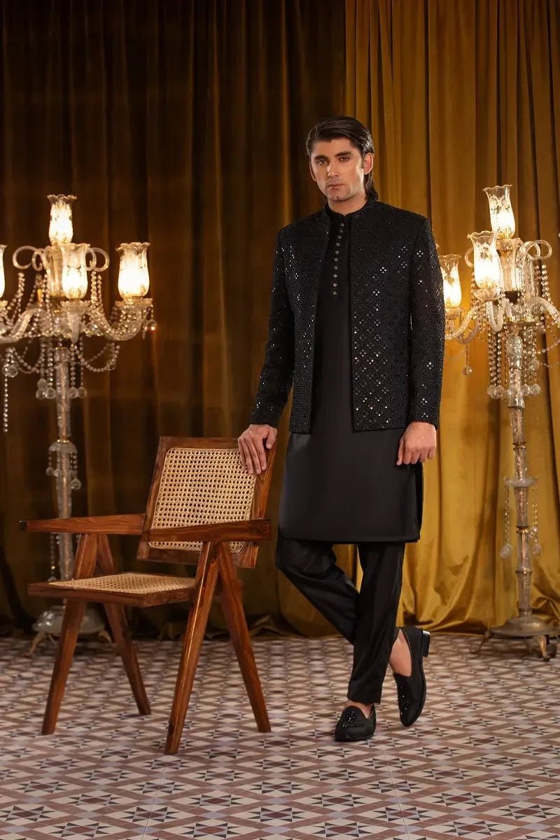 Abdan black raw silk jacket with intricate silver embellishments and a mandarin collar for formal wear