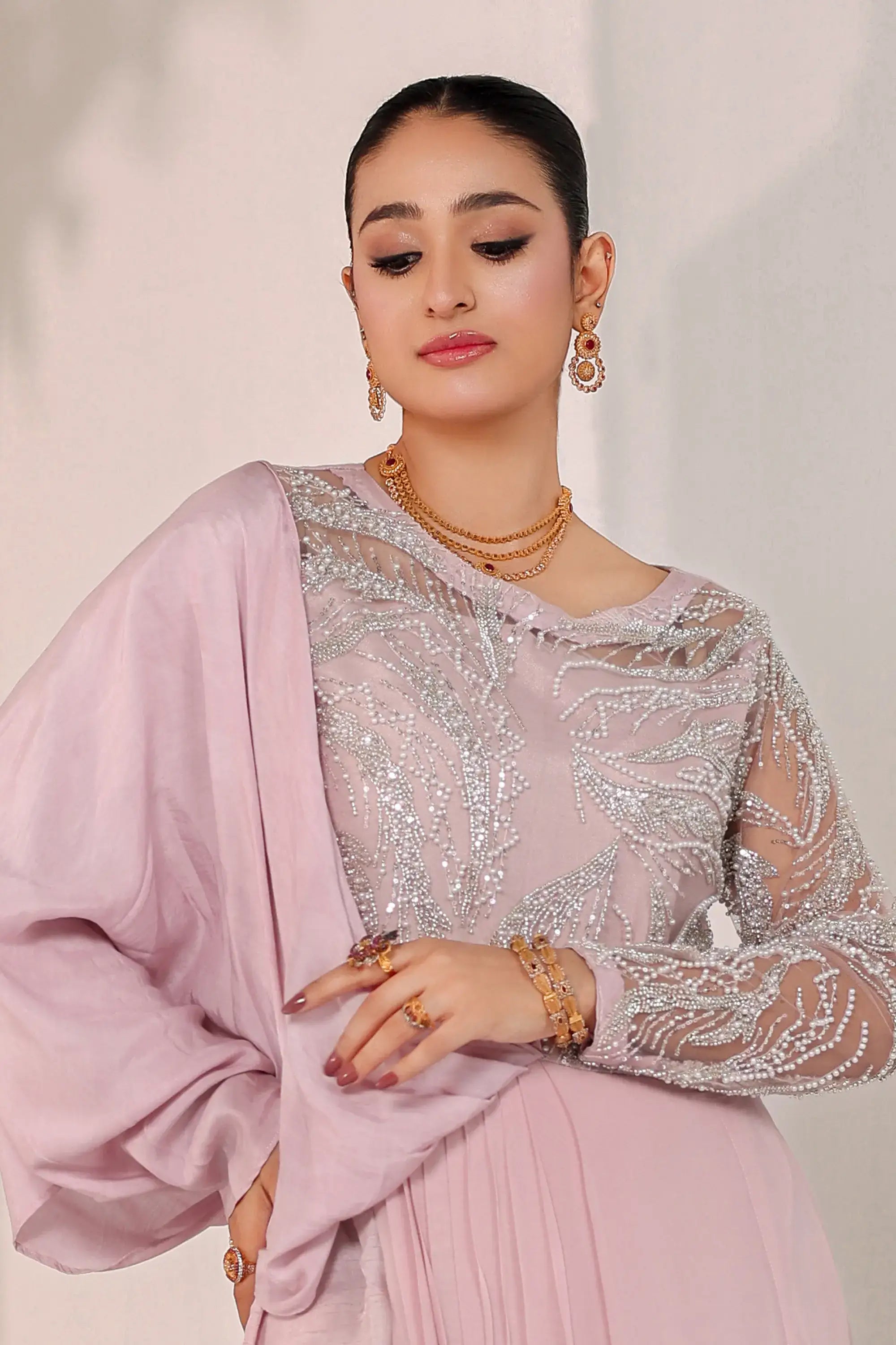 A delicate lavender silk top with silver beading and sheer sleeves from ahsan tariq blush opulence collection