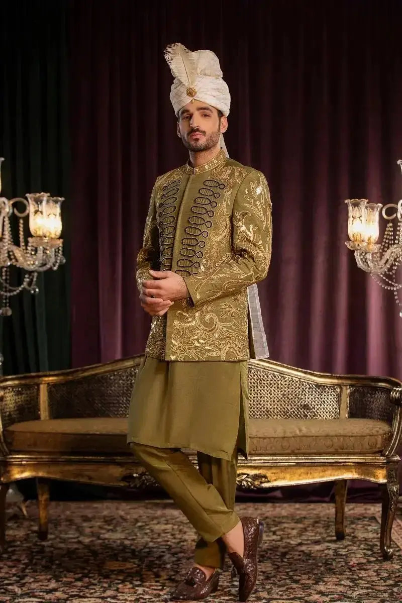 A man wearing a davr gold-embroidered sherwani with intricate doori work in premium quality raw silk and matching turban
