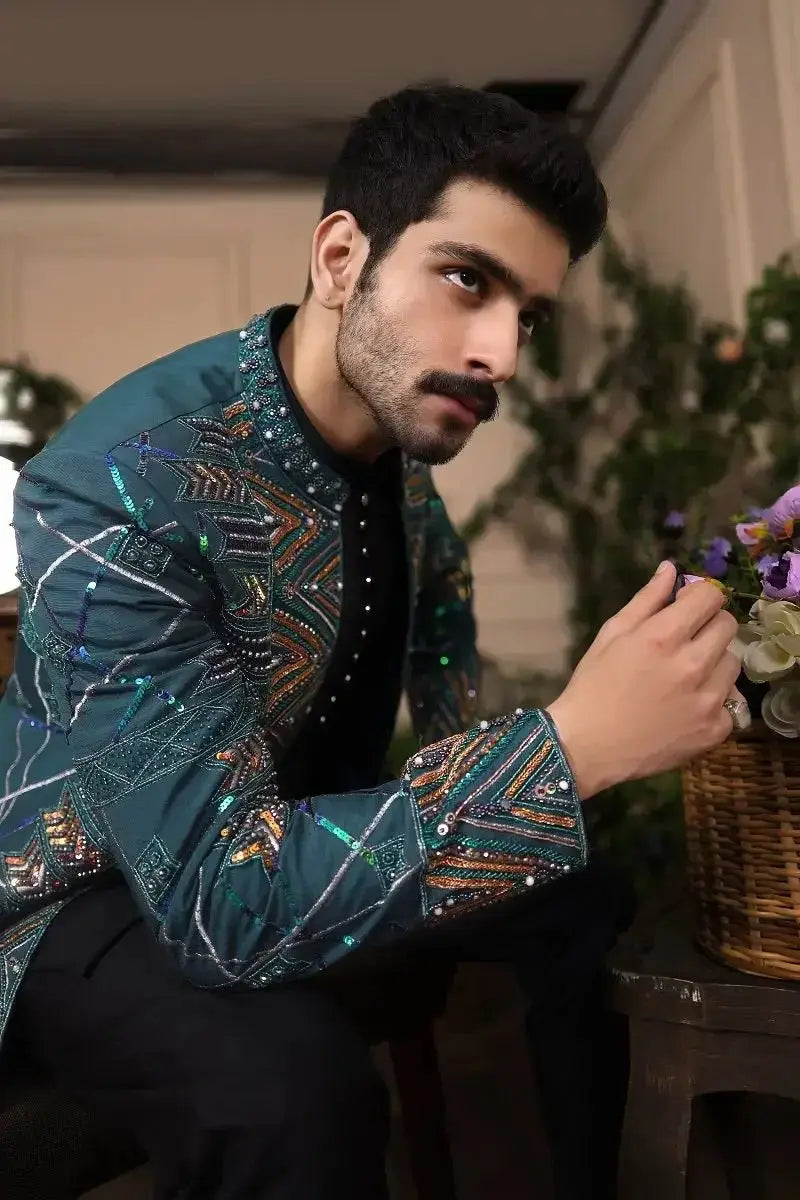 Teal embellished jacket fakhar-e-jahan with intricate geometric patterns and sequins for elegant wear