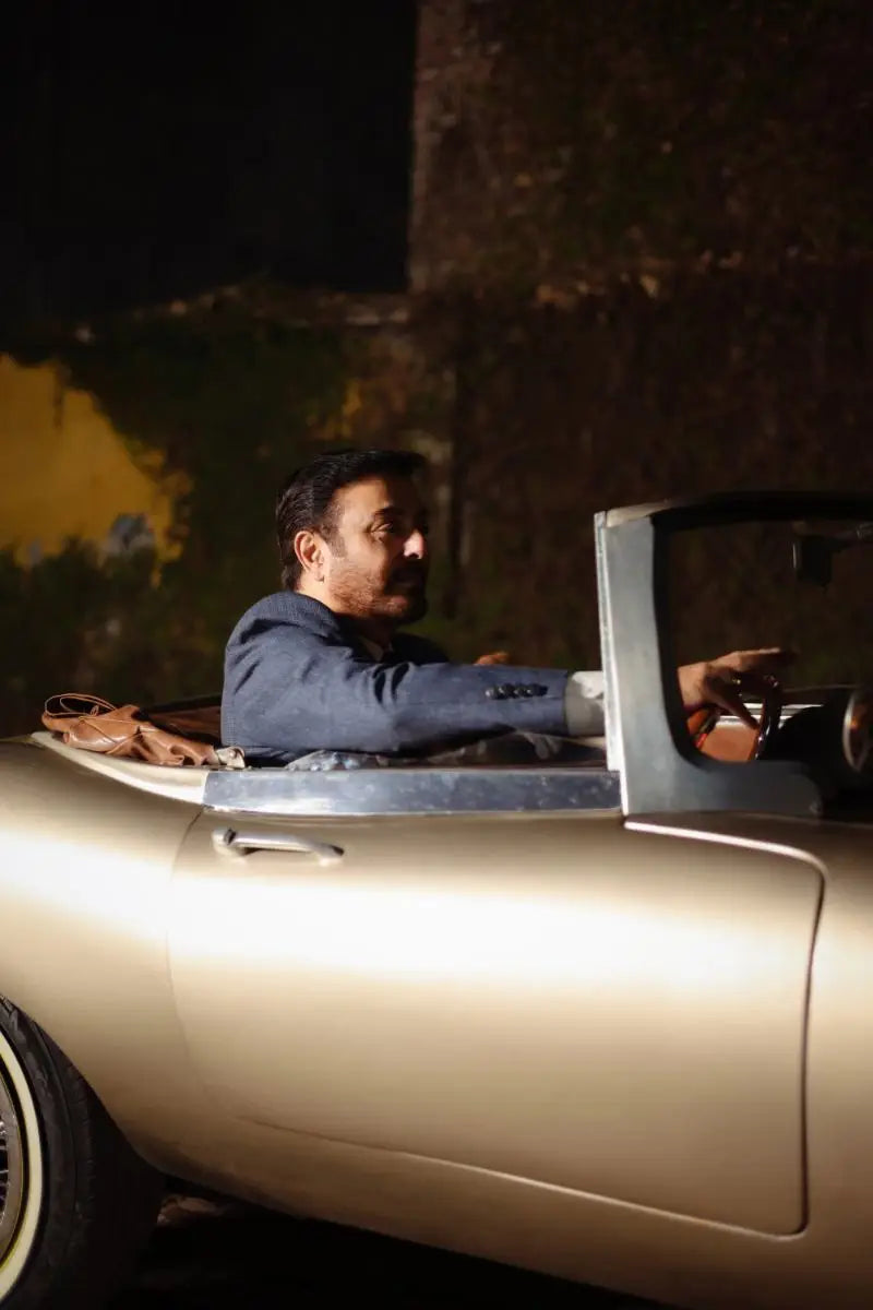 Muhammad Ali Virsa-e-Sitaaran Edit 26 sleek metallic gold convertible sports car with classic design and chrome accents