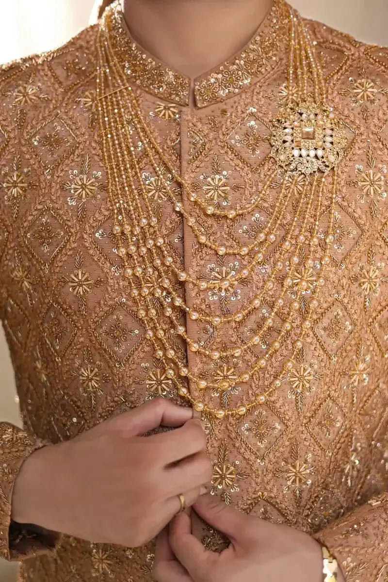 Gold beaded necklace with intricate multi-strand design and central ornate brooch for pehlwani poshak attire