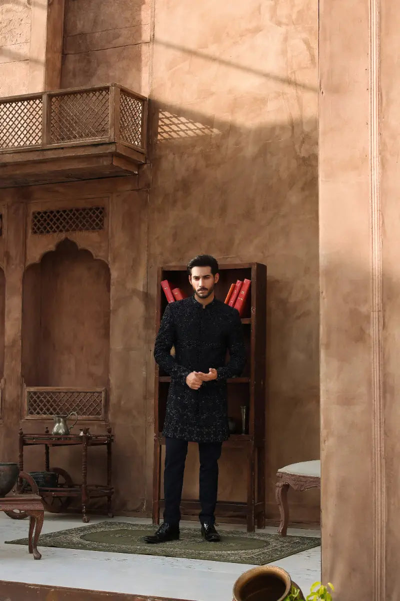 Black embroidered sherwani with intricate gold detailing from ahsan tariq ishq collection titled QARA