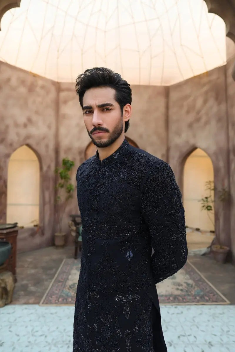 Black embroidered sherwani with intricate silver thread detailing from ahsan tariq ishq collection qara design