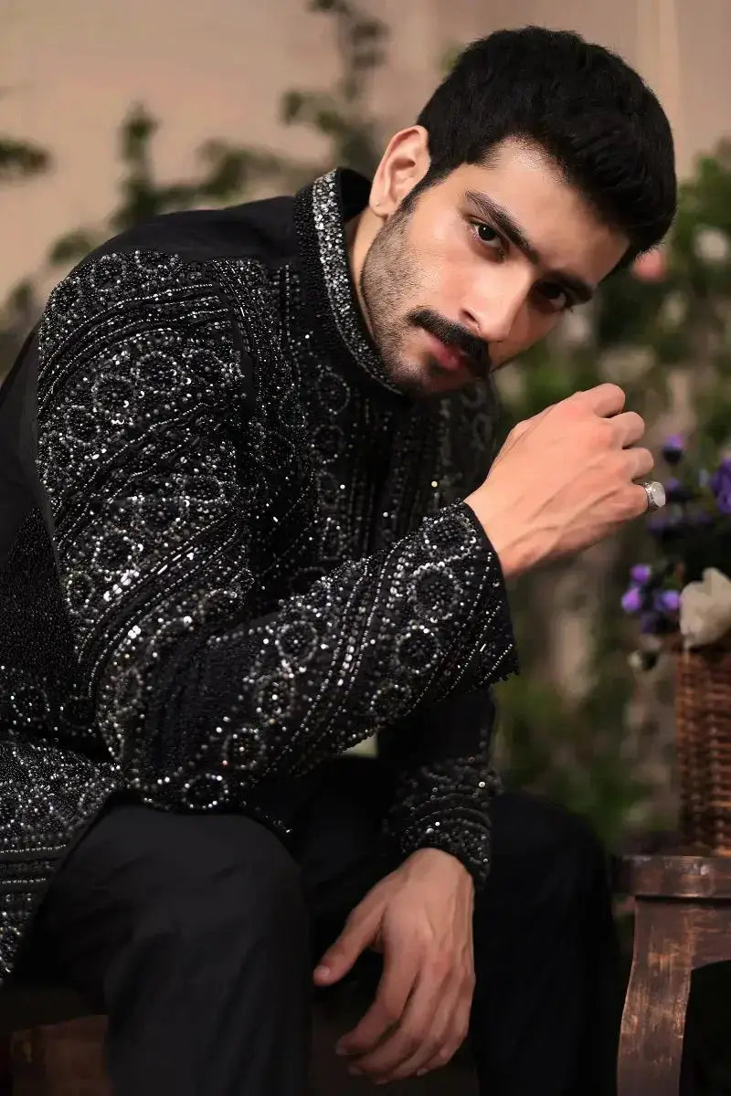 Black embellished formal jacket with intricate silver sequin patterns from ranjeet singh royal collection