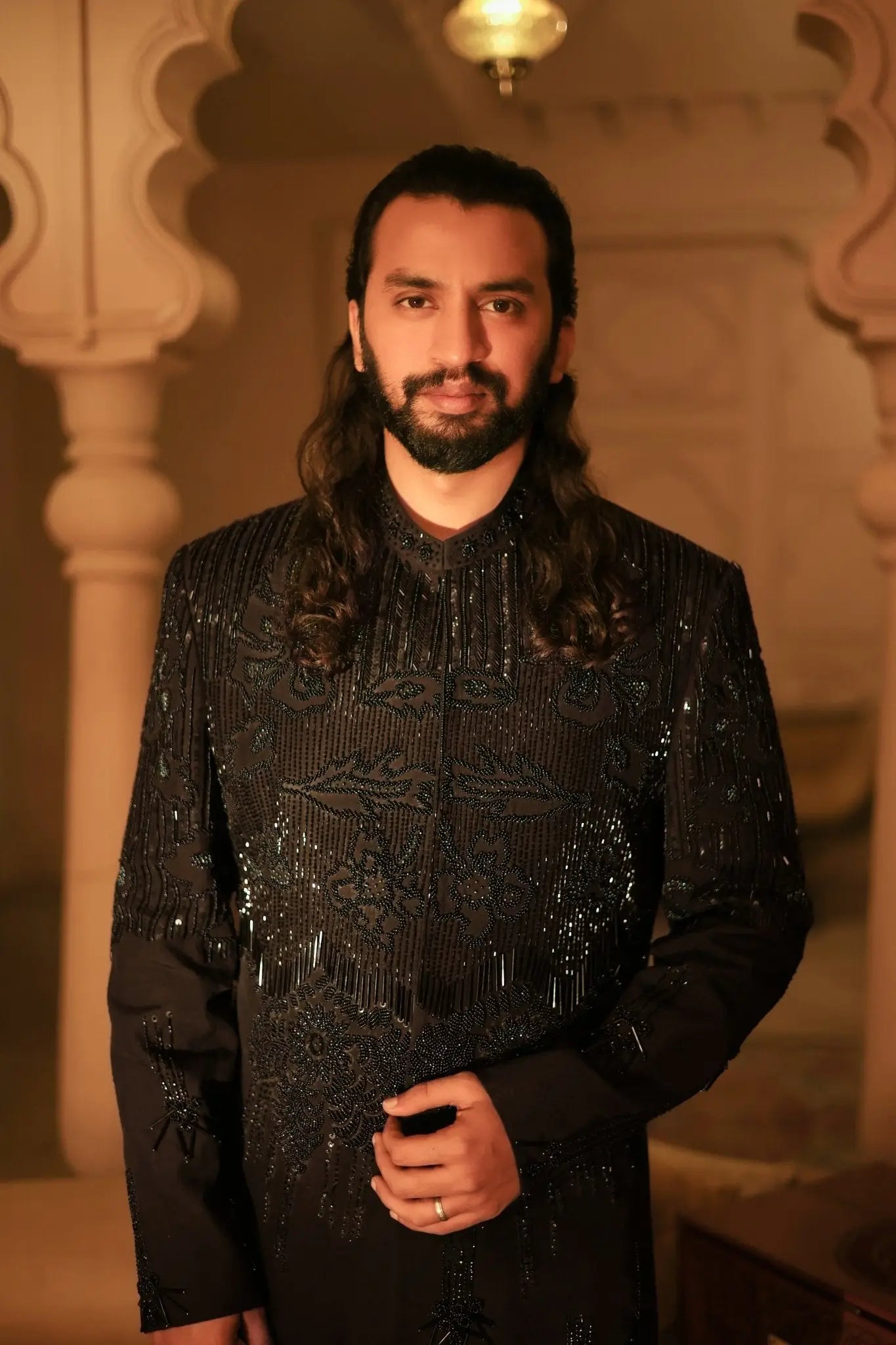 Black sequined shahenshah formal jacket with intricate embroidery and fringe detailing for elegant occasions