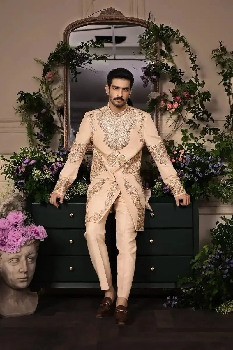 Beige shairshah formal suit with intricate gold thread embroidery and matching waist belt for elegant occasions