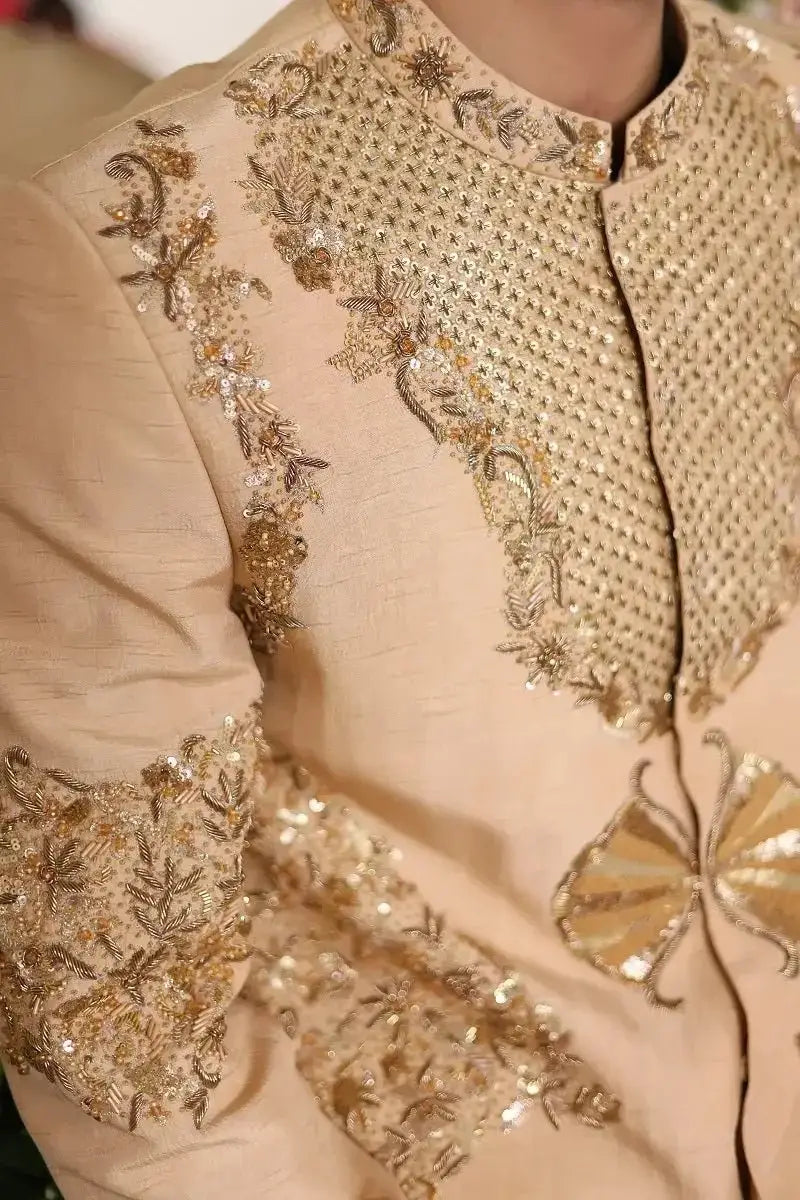 Beige silk sherwani shairshah with intricate gold embroidery and sequins perfect for traditional occasions