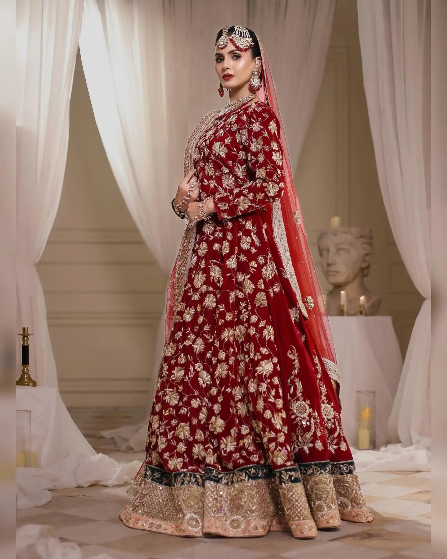 Shehnai peshwas rich red raw silk bridal lehenga with antique gold vine patterns and matching sheer dupatta