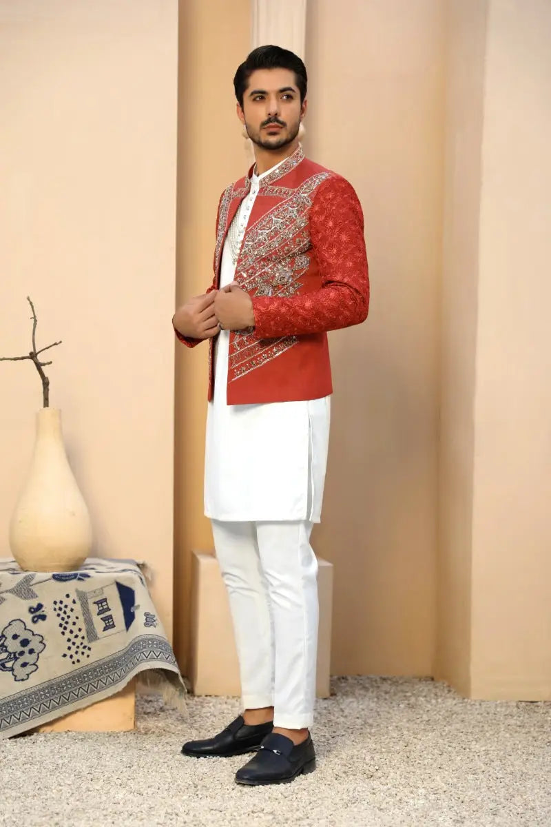 Red embroidered jacket yaqoot featuring intricate silver thread floral motifs by ahsan tariq