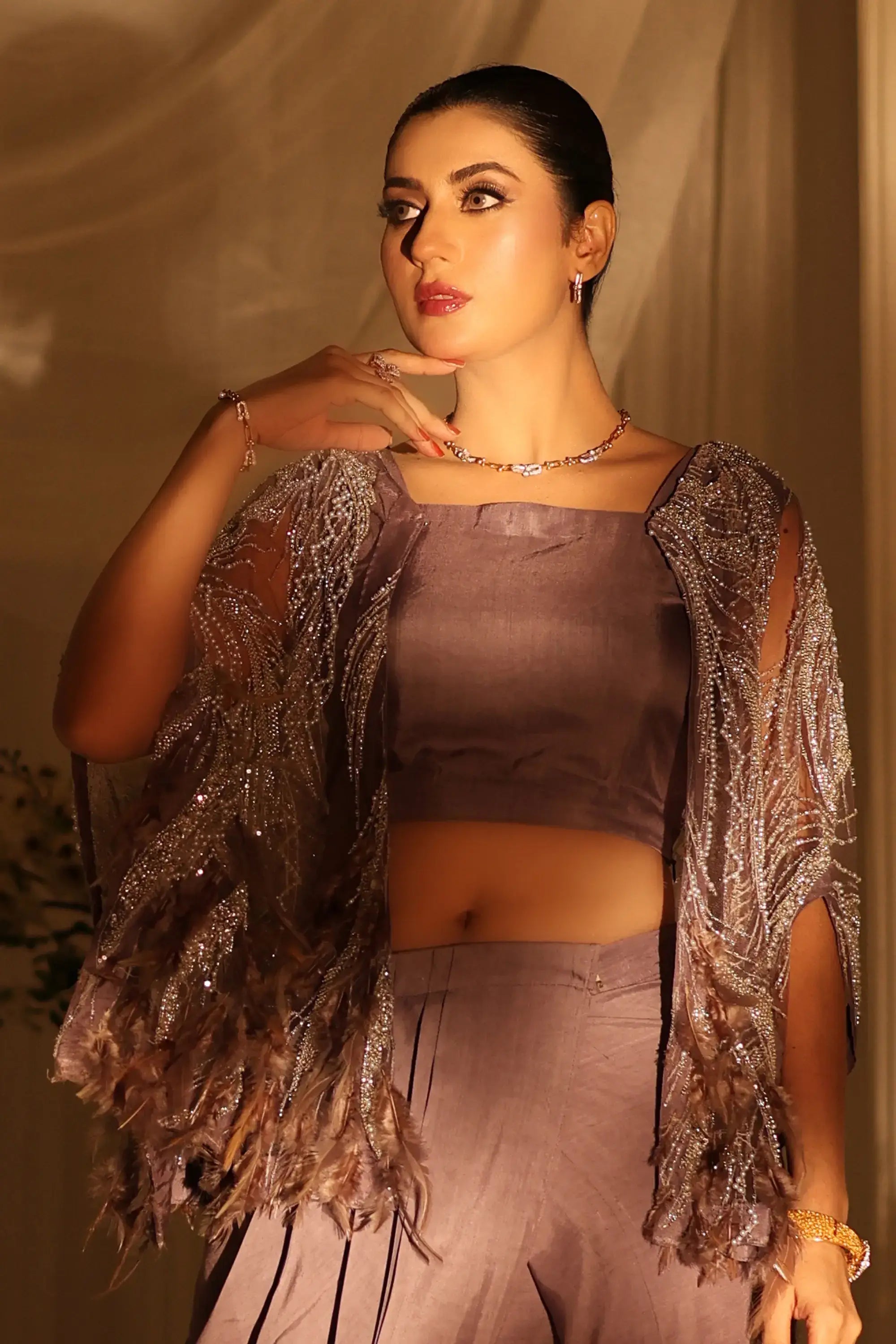 Amara drape ensemble metallic silver feathered cape with intricate beading and sheer overlay for elegant wear