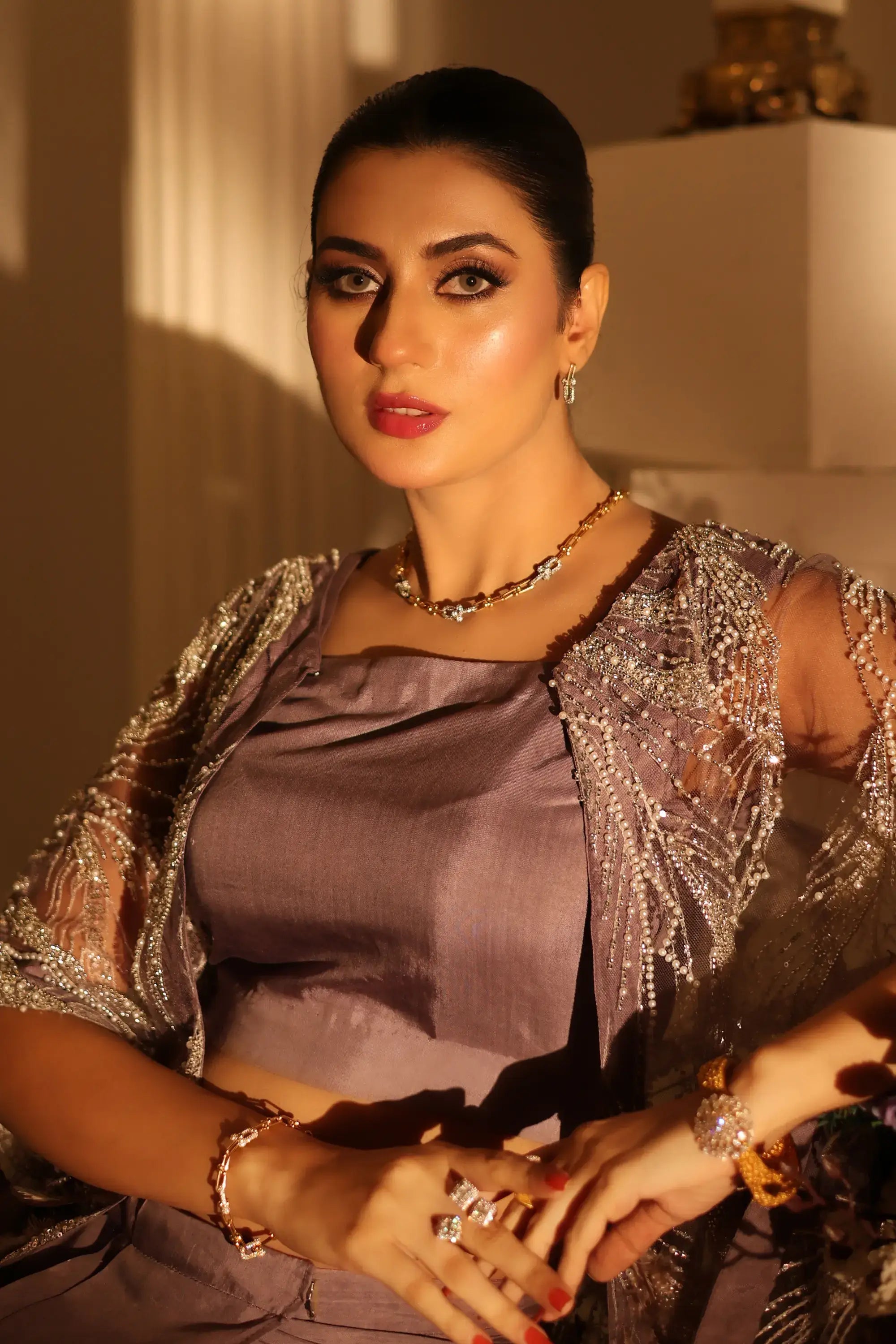 Amara drape ensemble shimmering silver beaded capelet with feather embellishments over mauve satin blouse