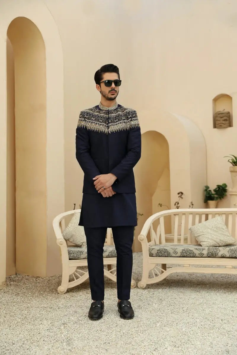 Navy blue kurta from raqeeb se collection with prince coat silhouette and intricate silver thread embroidery at neckline
