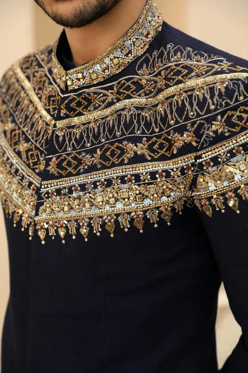 Azraq navy blue prince coat silhouette shirt with gold and silver floral and geometric embroidery from raqeeb se collection