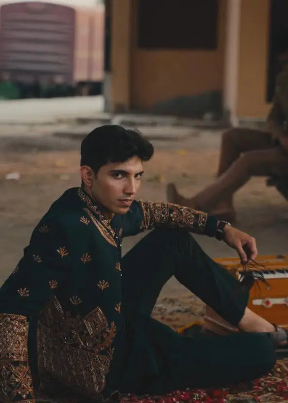 Dark green embroidered sherwani bagh-e-zar with intricate gold thread detailing perfect for formal occasions