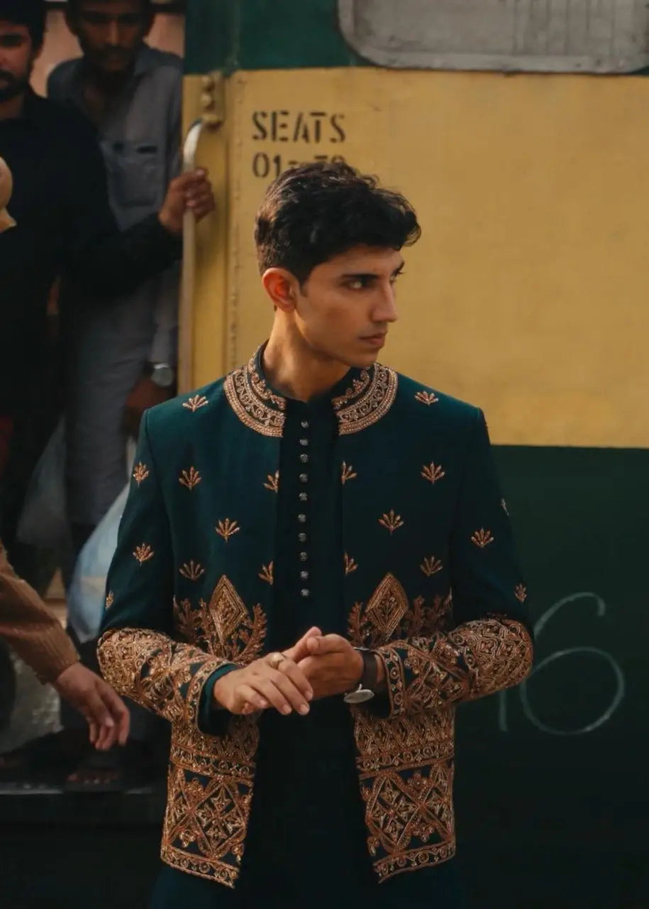 Bagh-e-zar dark teal men’s sherwani jacket with intricate gold embroidery on collar cuffs and front panels
