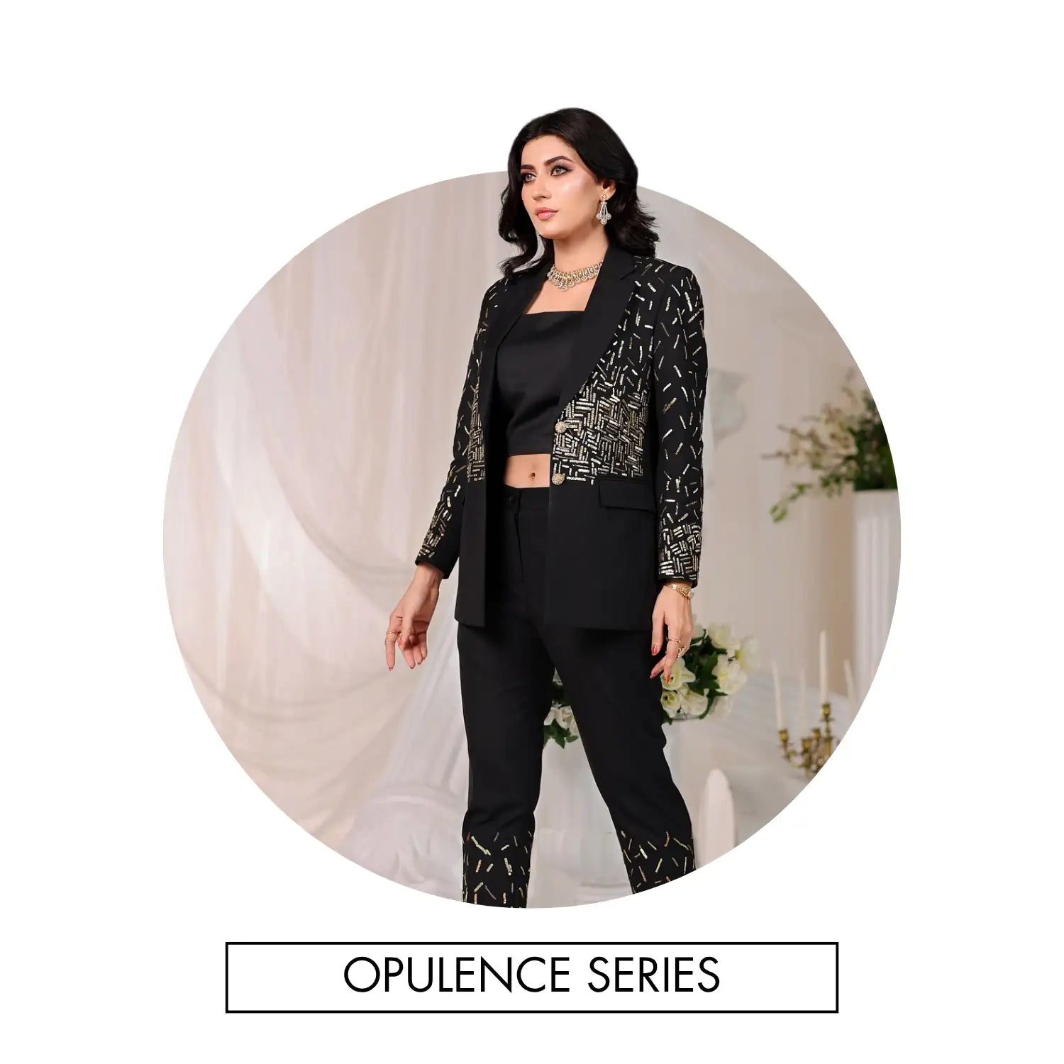 Black blazer with a bold geometric pattern in metallic silver, featuring tailored shoulders and long sleeves.