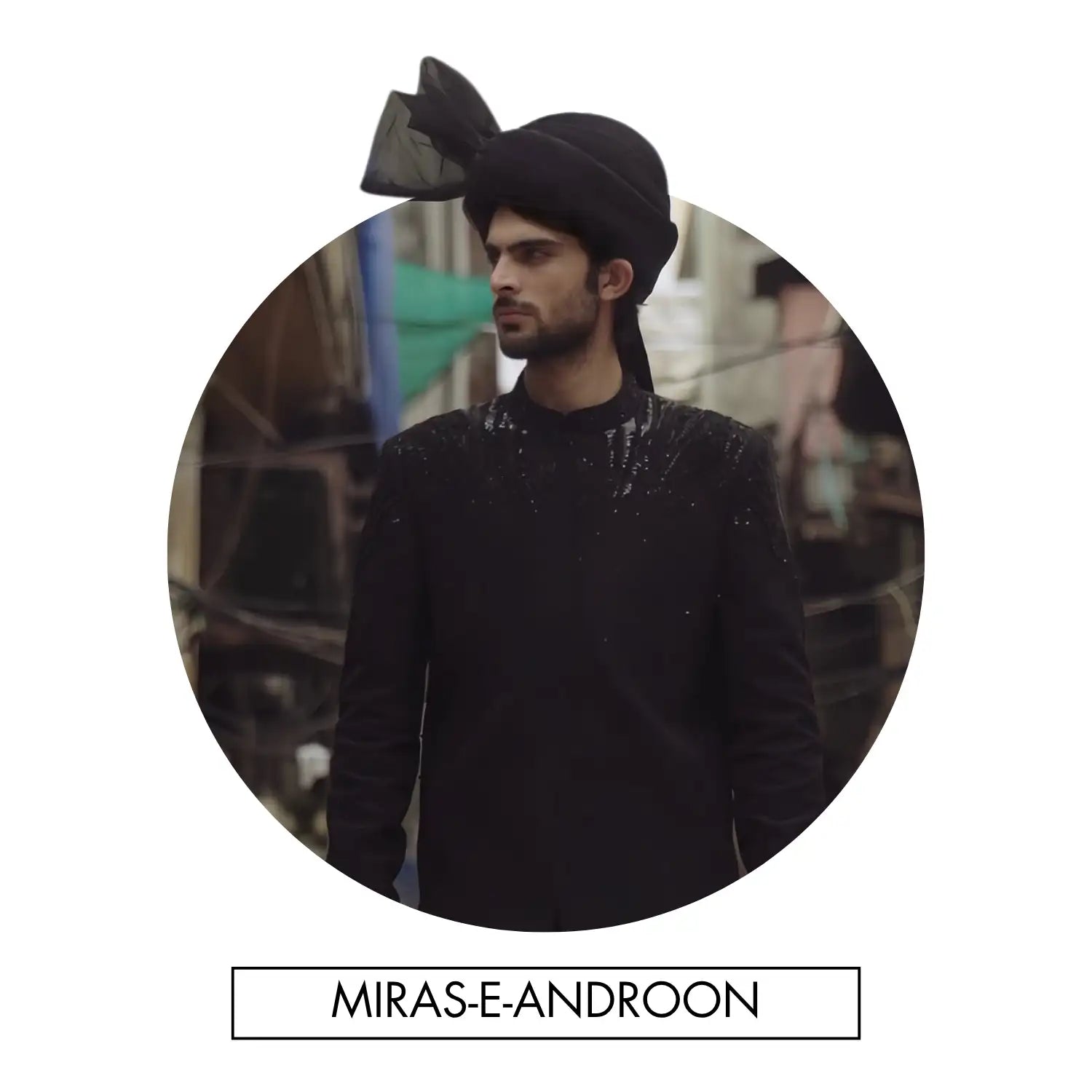 Black turban with a sheer black bow on top