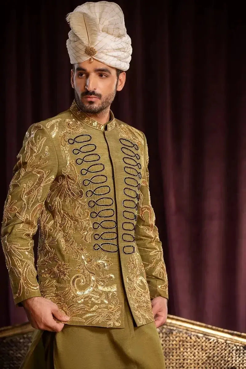 Olive green raw silk sherwani by davr with premium quality gold doori work embroidery and black decorative buttons