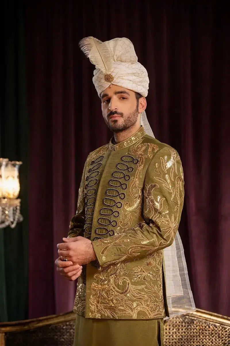 Olive-green davr sherwani in premium quality raw silk with gold doori work and matching turban with feather detailing