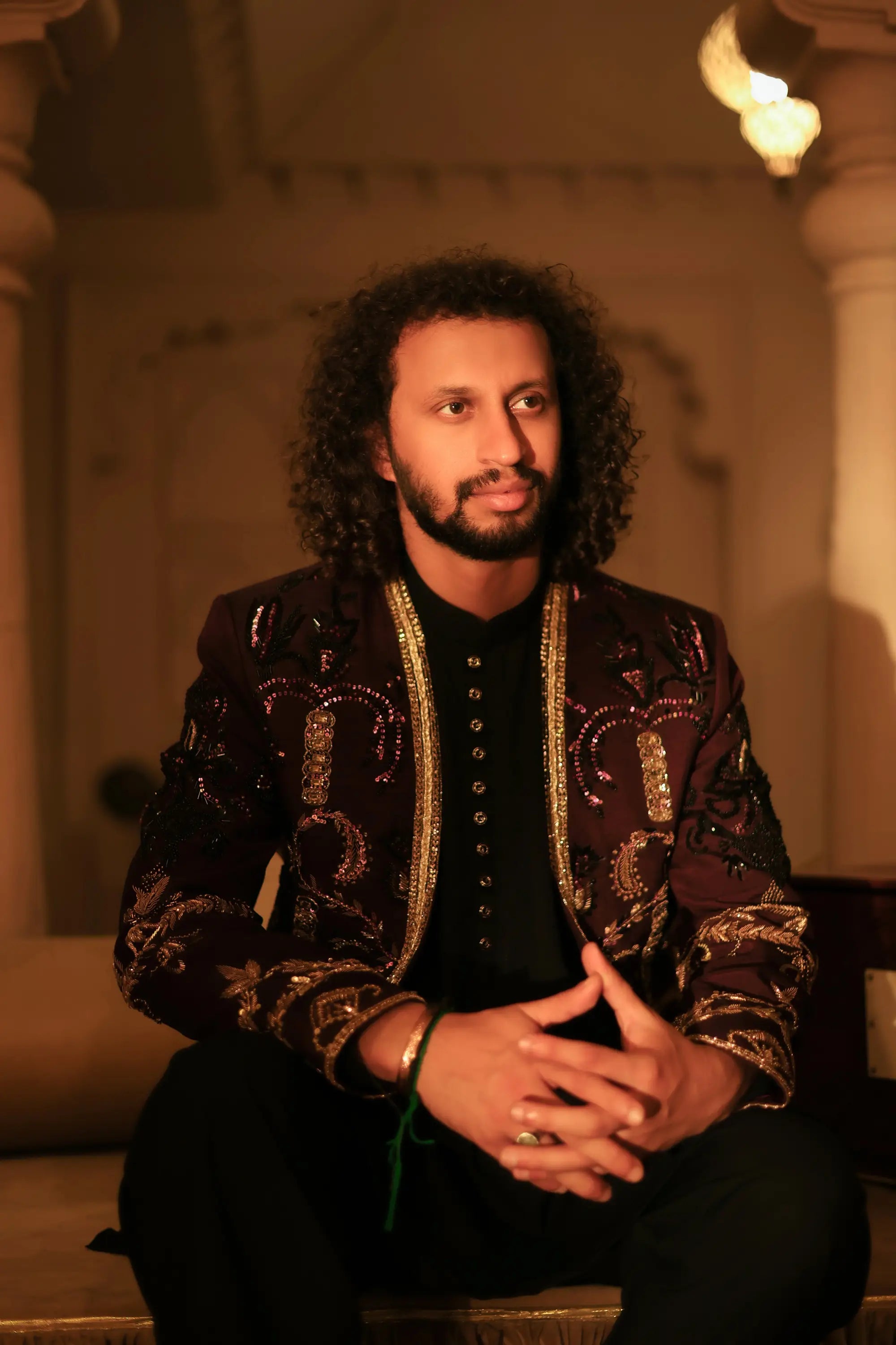 Ghazi richly embroidered maroon and gold jacket with intricate metallic threadwork detail