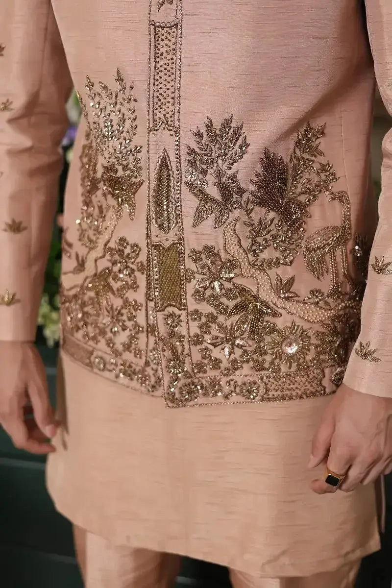 A blush pink raw silk kurta gulzar e raunaq with intricate gold thread and sequin floral and bird embroidery
