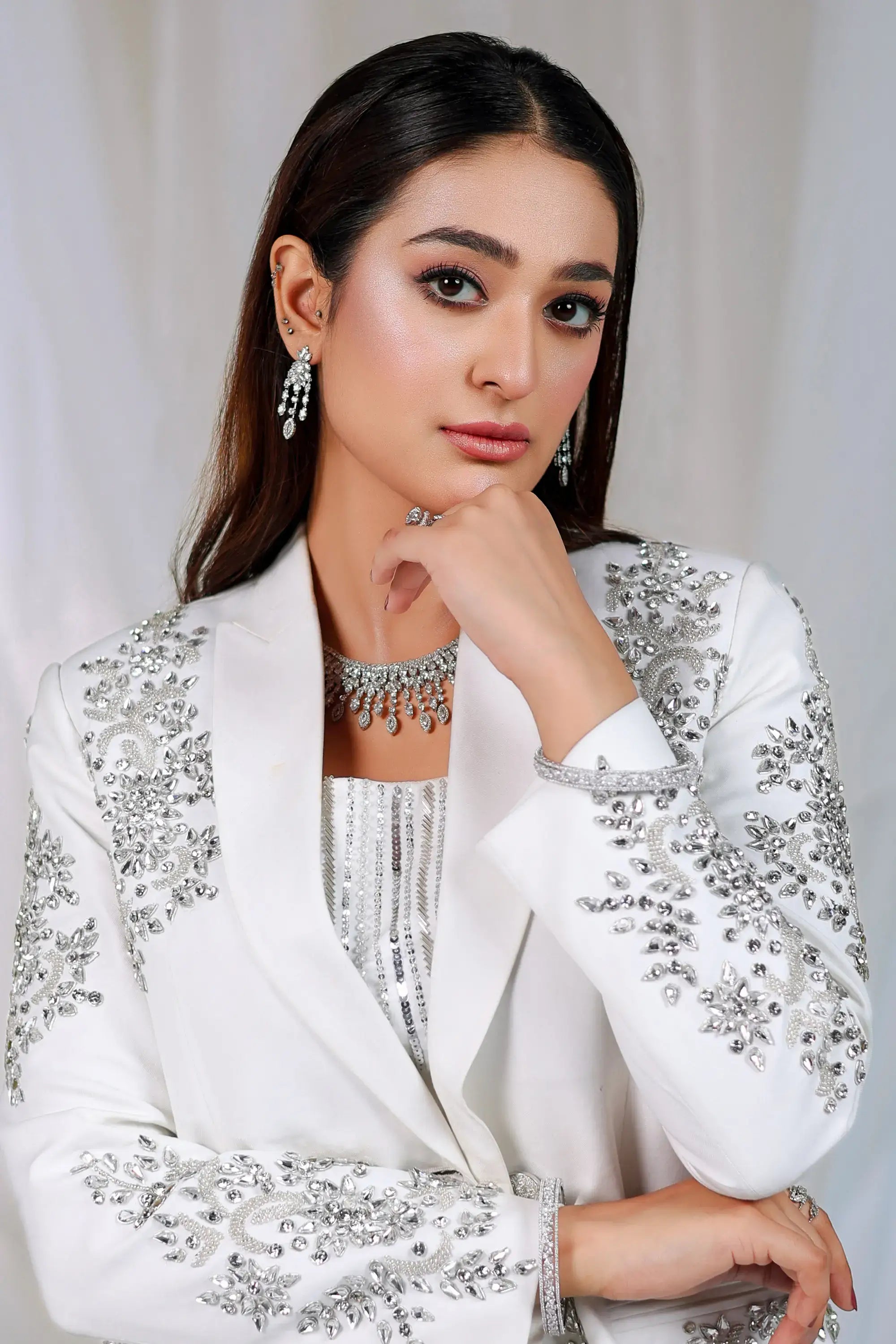 Ivory radiance white blazer by ahsan tariq with intricate silver embellishments and sparkling rhinestones for formal wear