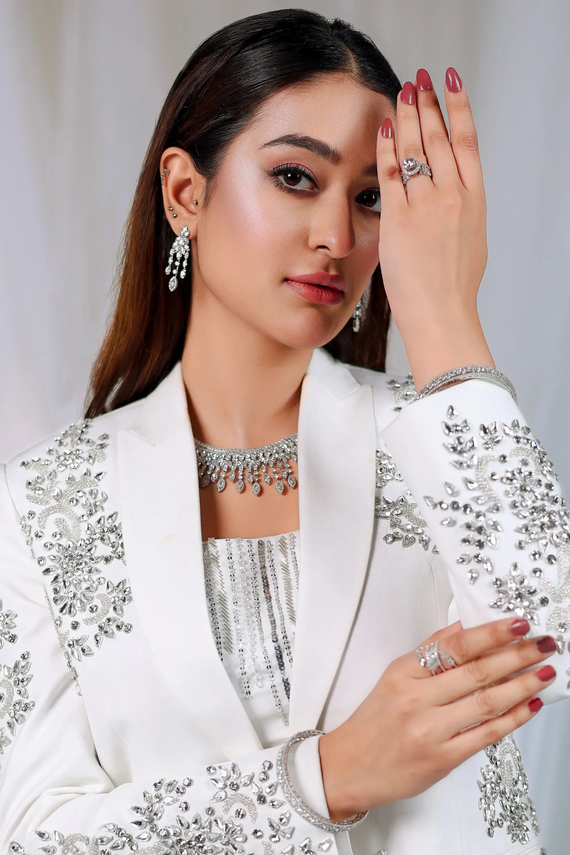 Ivory Radiance white blazer with intricate silver embellishments and sparkling crystals by Ahsan Tariq for formal wear