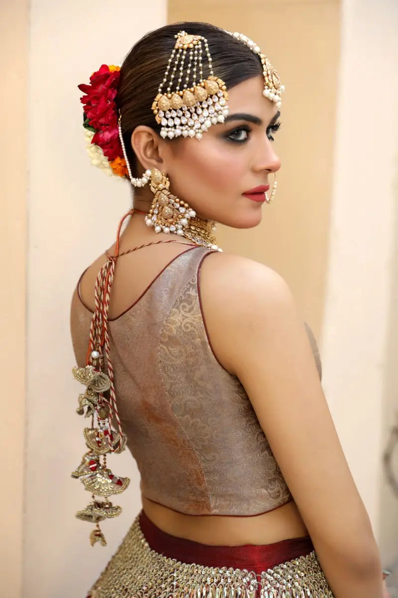 Gold-toned antique gold tilla maang tikka malika with intricate beadwork and pearl accents by ahsan tariq