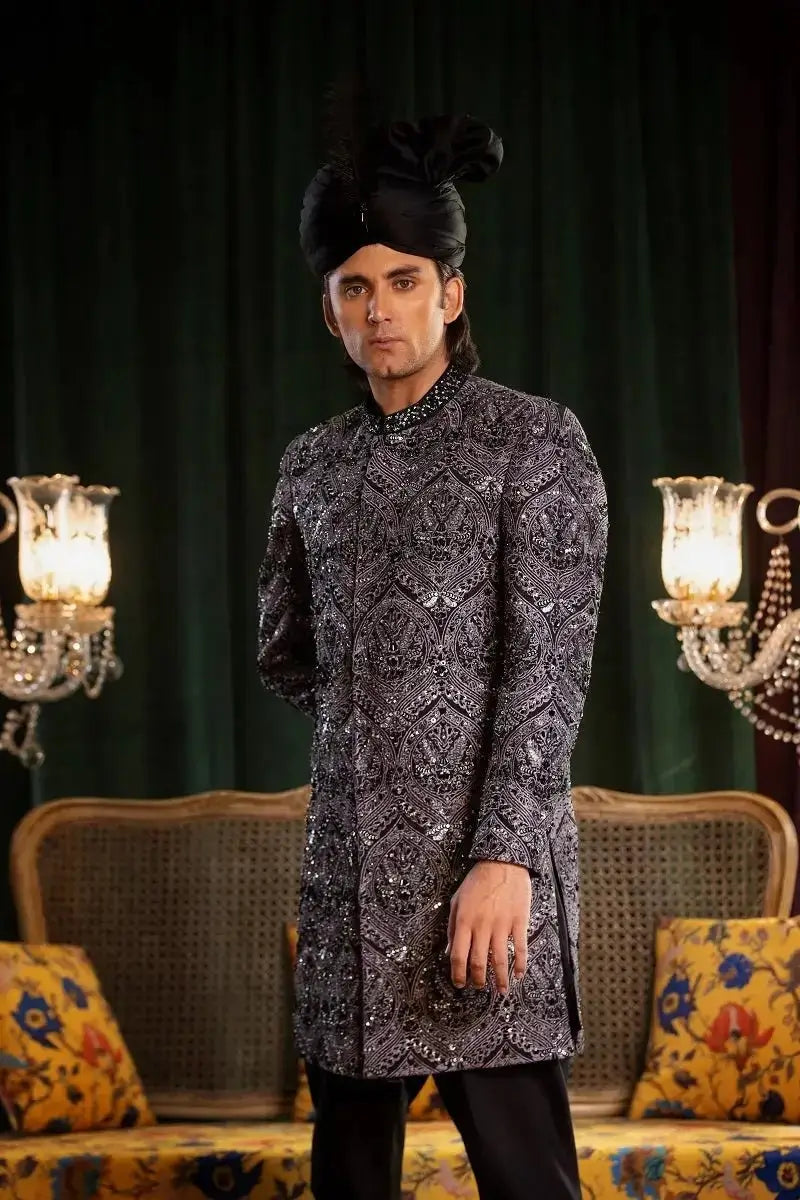 Mastaan black raw silk sherwani with intricate silver thread embroidery for elegant traditional wear