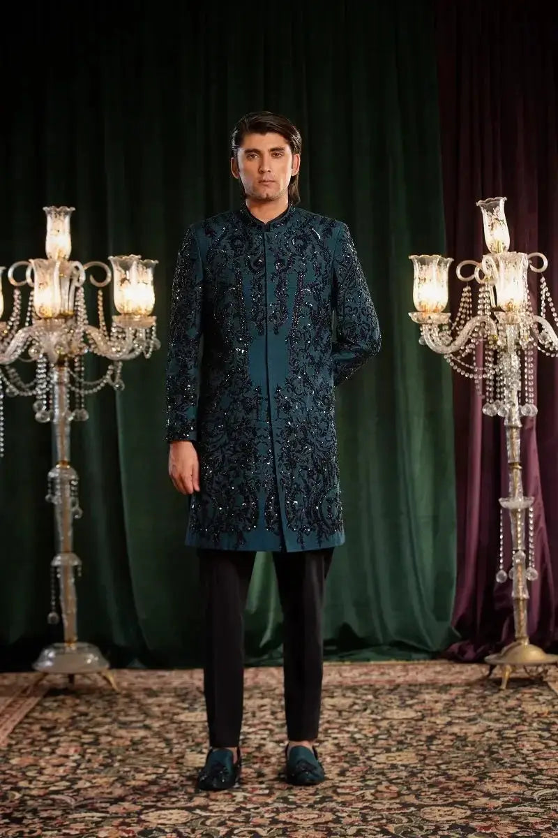 Dark teal embroidered sherwani named mayameen with intricate black and silver threadwork detailing