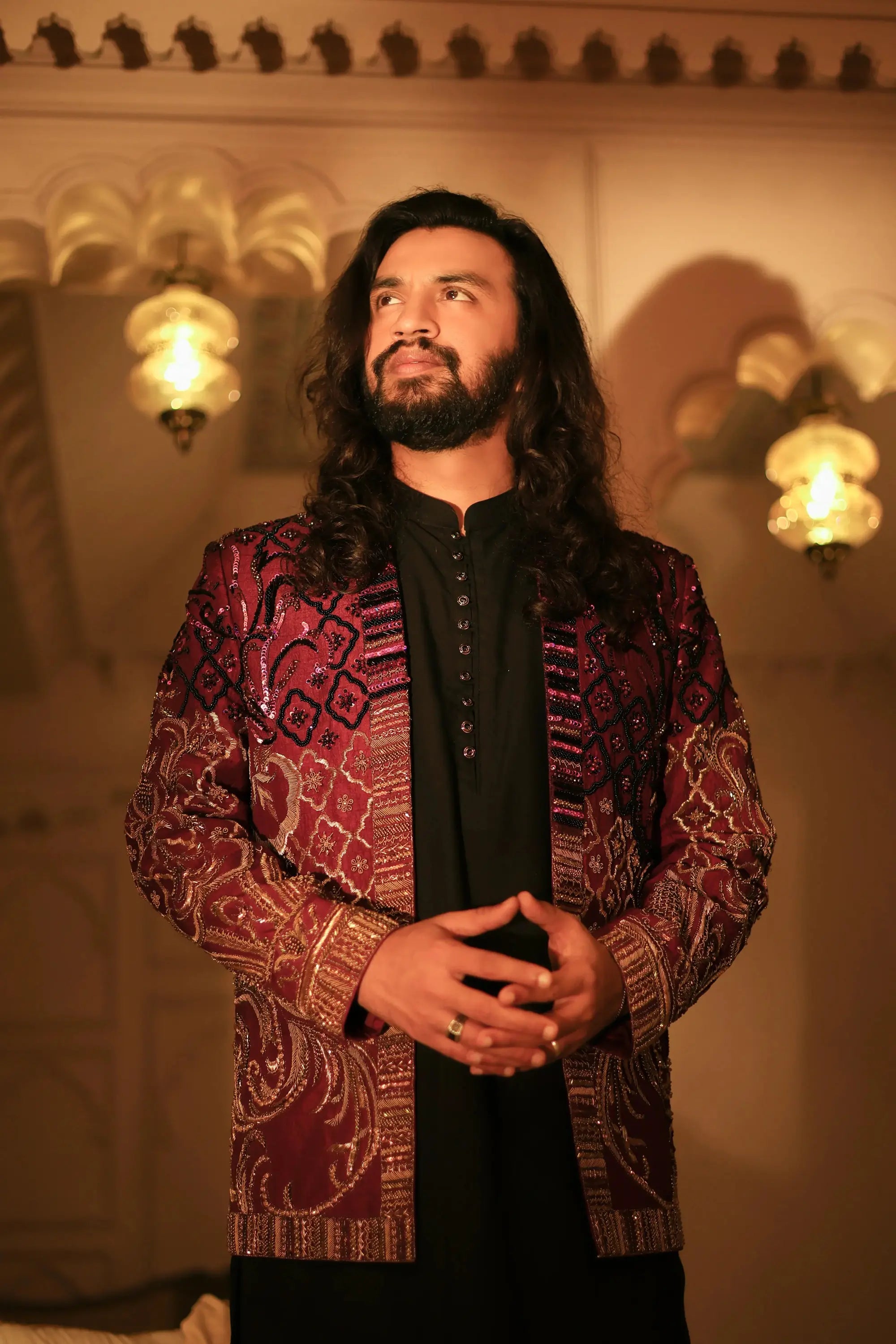 Mirza richly embroidered maroon and gold jacket with intricate geometric designs on heavy fabric