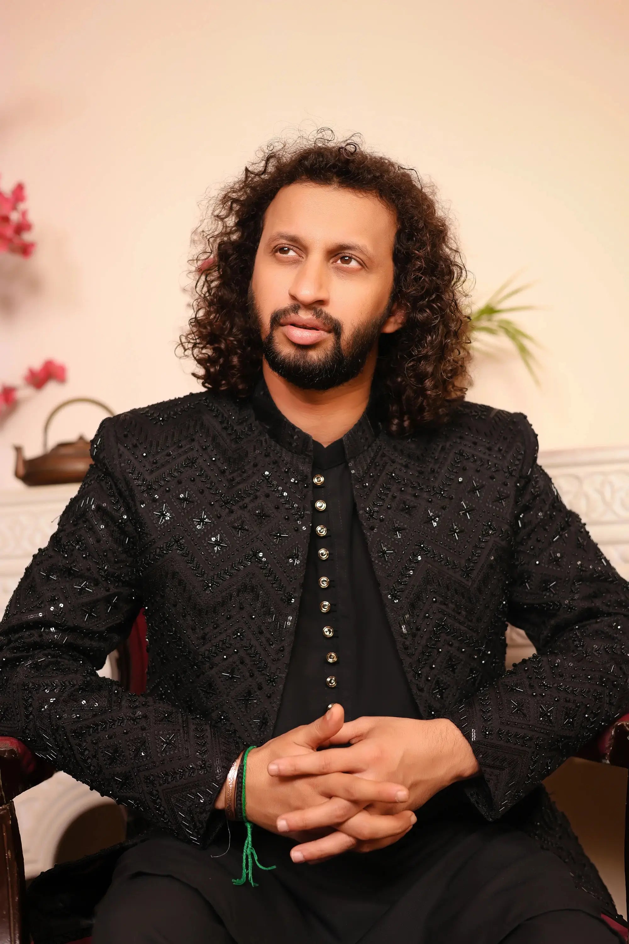 Black embellished nawab jacket with intricate sequin detailing and silver toned buttons on the front side