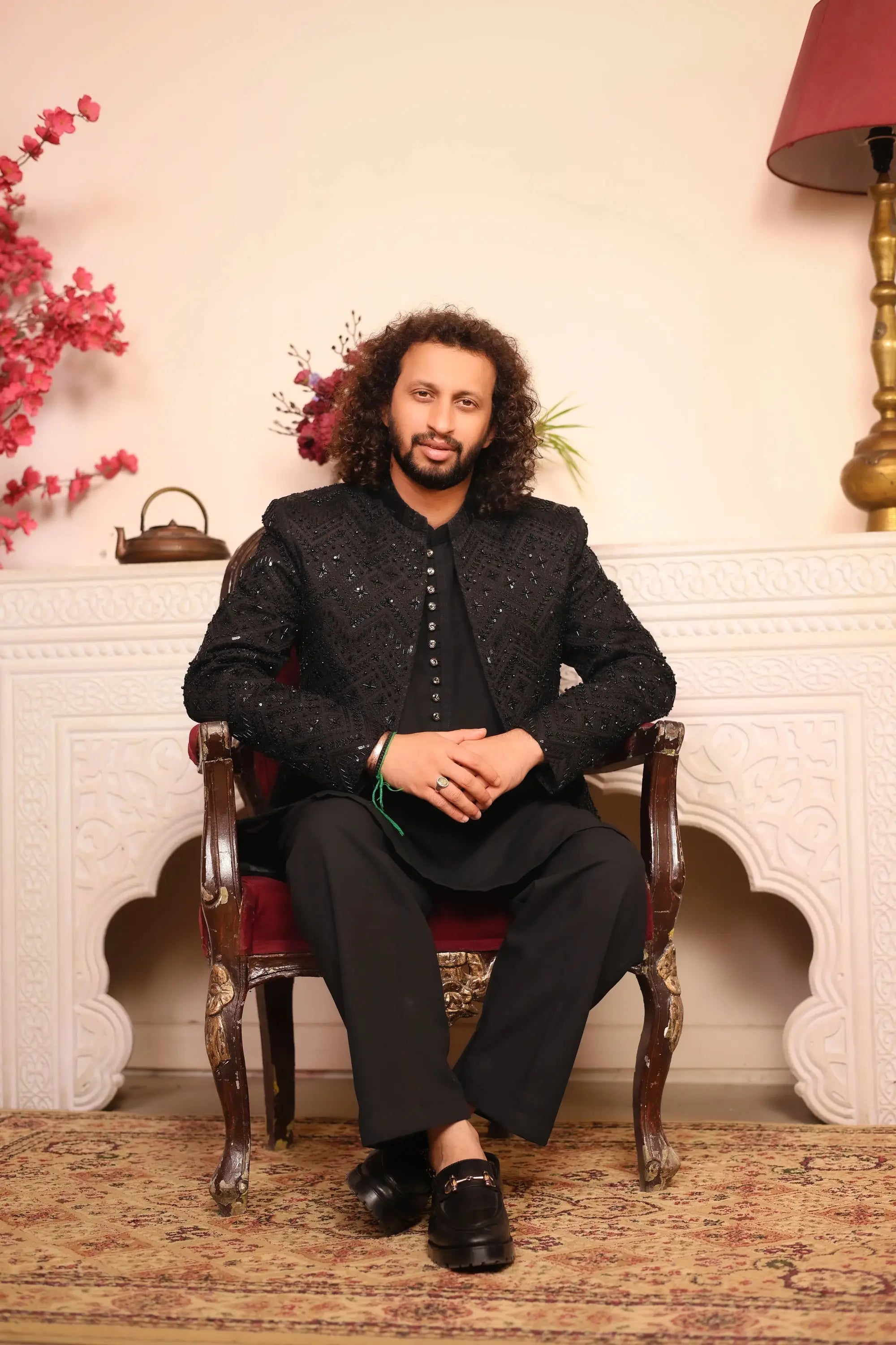 Black sequined nawab jacket with intricate embroidery and buttoned front for elegant formal wear