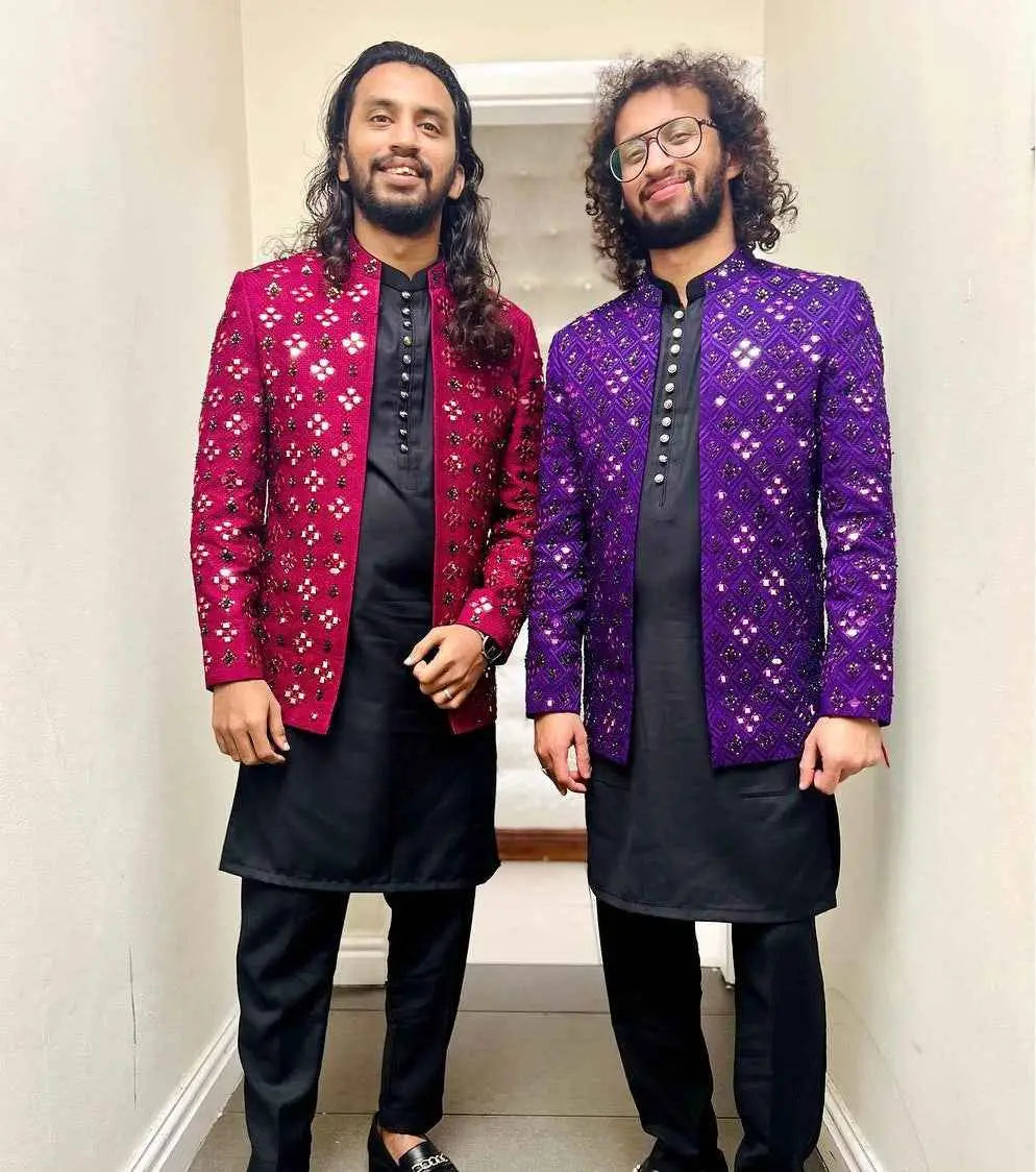 Two men wear hand-embellished prince coats in magenta and deep purple that redefine festive luxury in nawabs collection