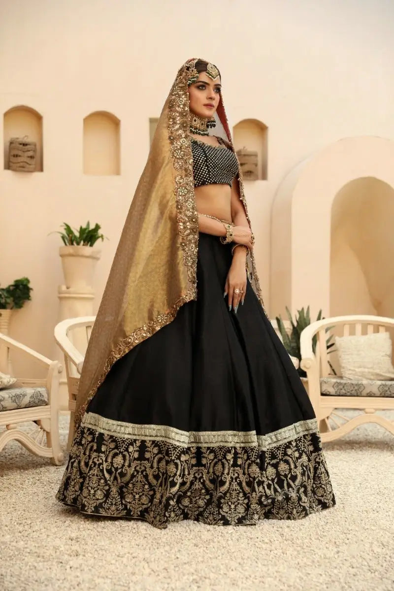 Black lehenga with gold embroidery and matching sheer dupatta from nayab by ahsan tariq prince coat collection