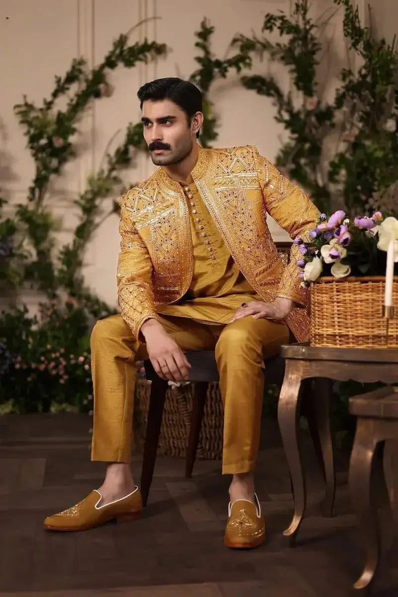 Gold embroidered raw silk formal suit with intricate detailing and matching trousers nishan-e-manzil collection