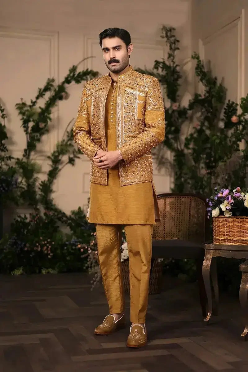 Golden embroidered sherwani with intricate beadwork and matching raw silk tunic from nishan-e-manzil collection