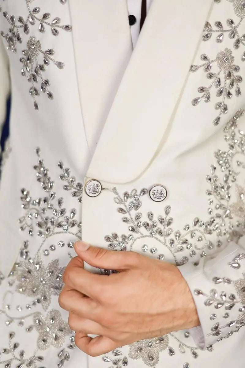 White blazer from notte di lusso featuring intricate silver beading floral embroidery and matching circular buttons