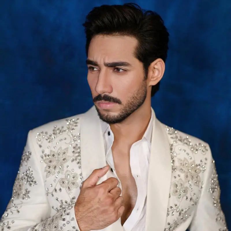 White embellished blazer with intricate silver floral embroidery from notte di lusso ishq eid t26 collection