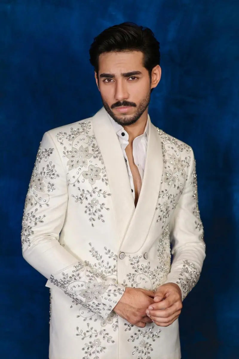 White embellished tuxedo jacket with intricate silver floral embroidery from notte di lusso ishq eidt26 collection