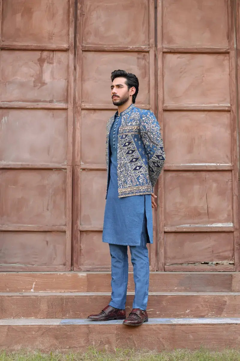 Blue embroidered prince coat qalb from ahsan tariqs ishq collection with intricate gold and black patterns
