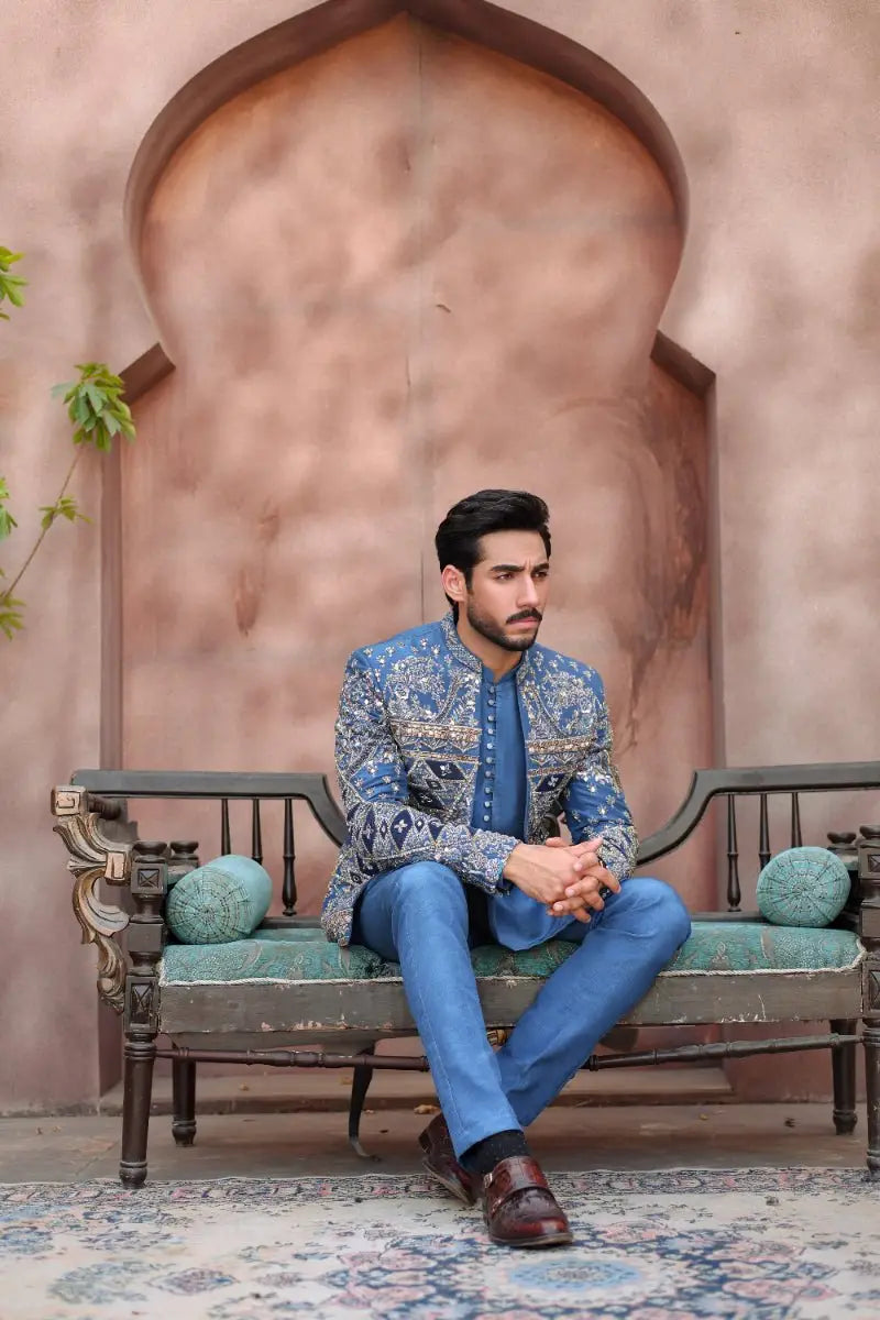 Blue embroidered sherwani from ahsan tariqs ishq collection with intricate silver thread detailing prince coat style