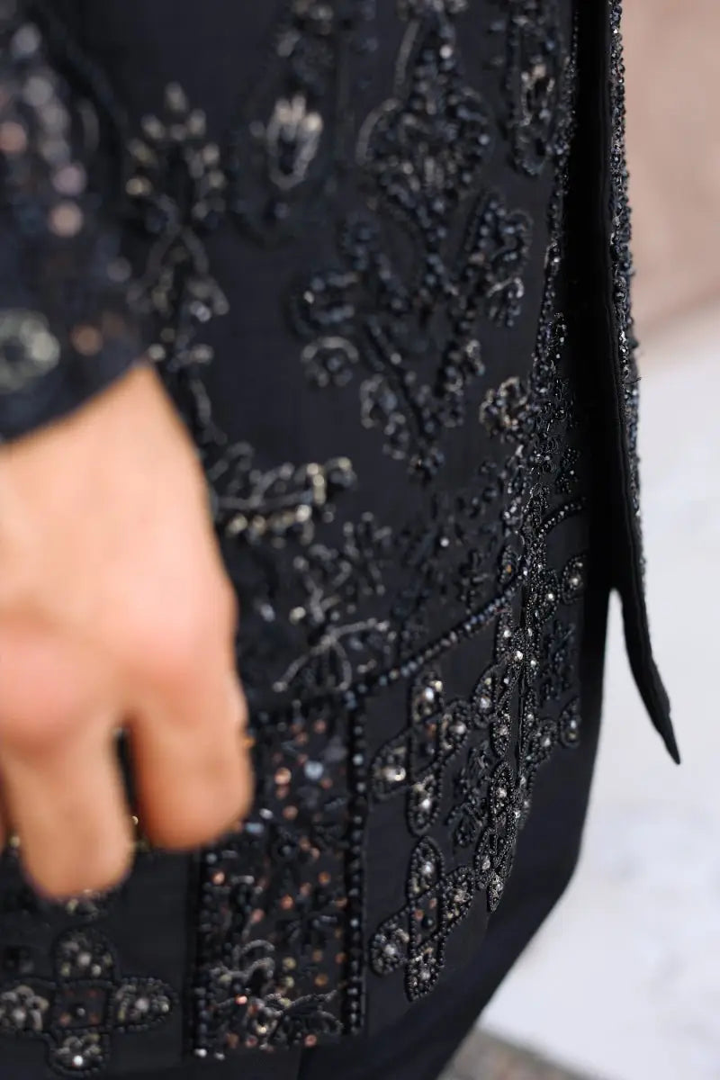 Black dress from qara featuring intricate beaded floral embroidery by ahsan tariq ishq collection