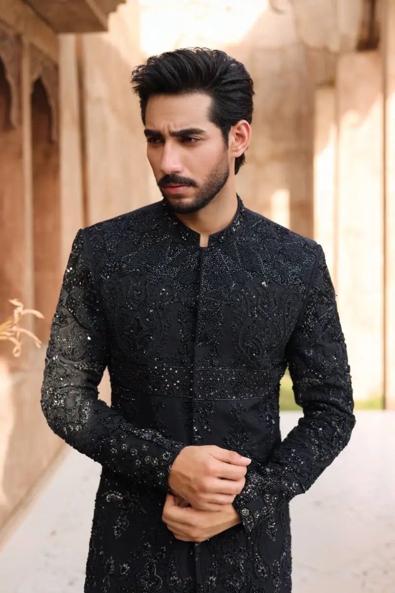 Black embroidered sherwani with intricate silver thread detailing from ahsan tariq ishq collection qara