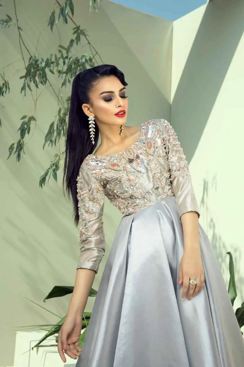 Elegant silver gown Quicksilver with intricate beaded embroidery and flowing satin skirt a mesmerizing blend by Ahsan Tariq