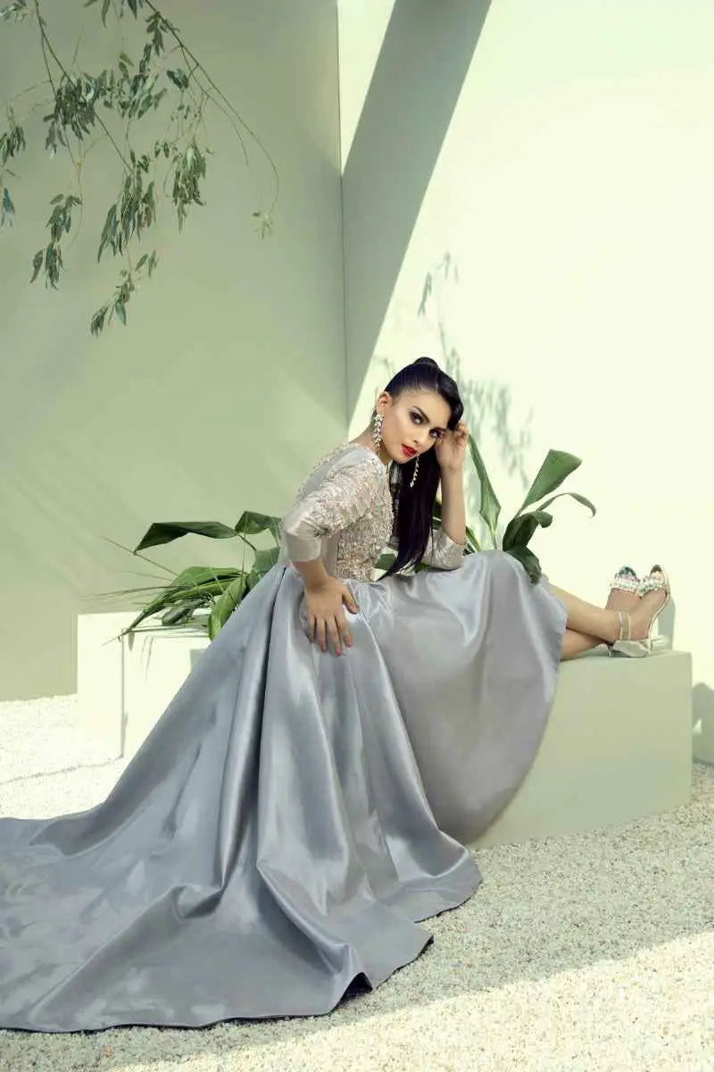 A mesmerizing blend of ahsan tariq silver-gray satin gown with fitted bodice and expansive train named quicksilver