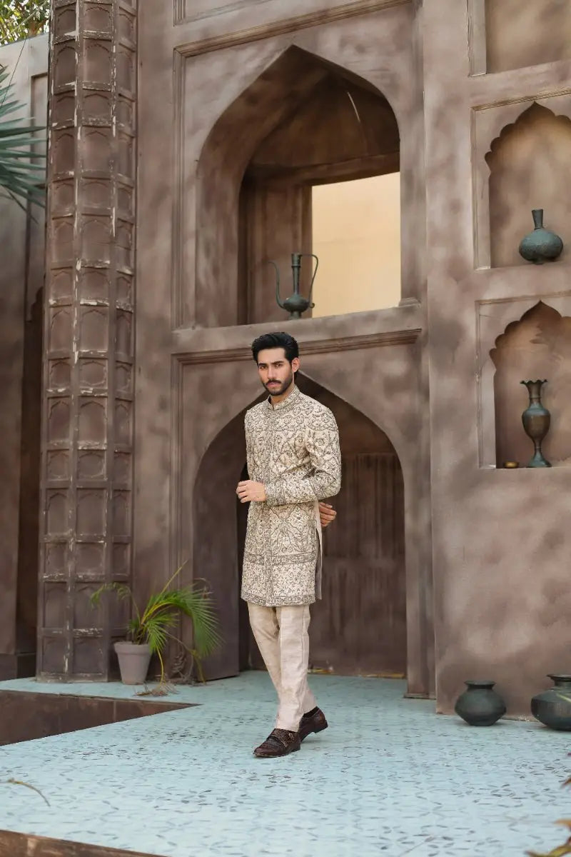Beige embroidered kurta with intricate gold thread patterns and matching trousers from ahsan tariqs ishq collection qur-b