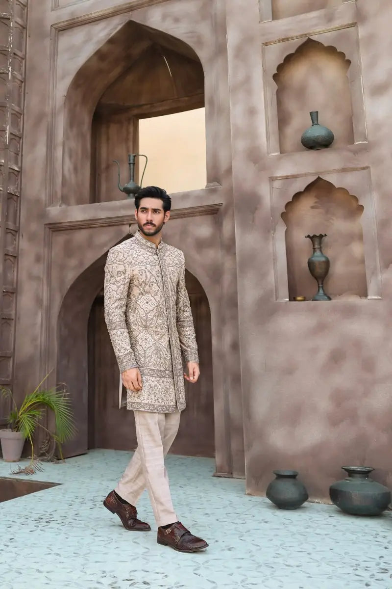 Beige embroidered sherwani from ahsan tariqs ishq collection featuring intricate gold thread detailing sandskin sherwani