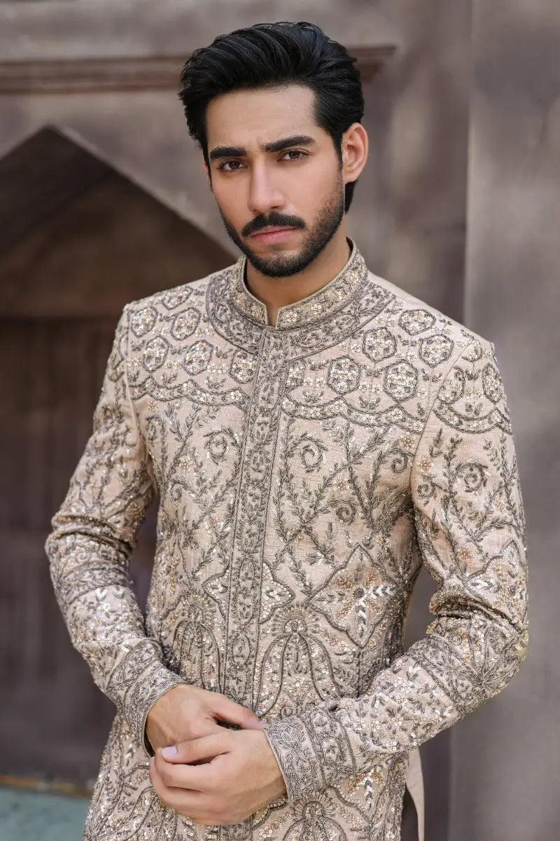 Beige sandskin sherwani from ahsan tariqs ishq collection with intricate silver threadwork and sequin detailing